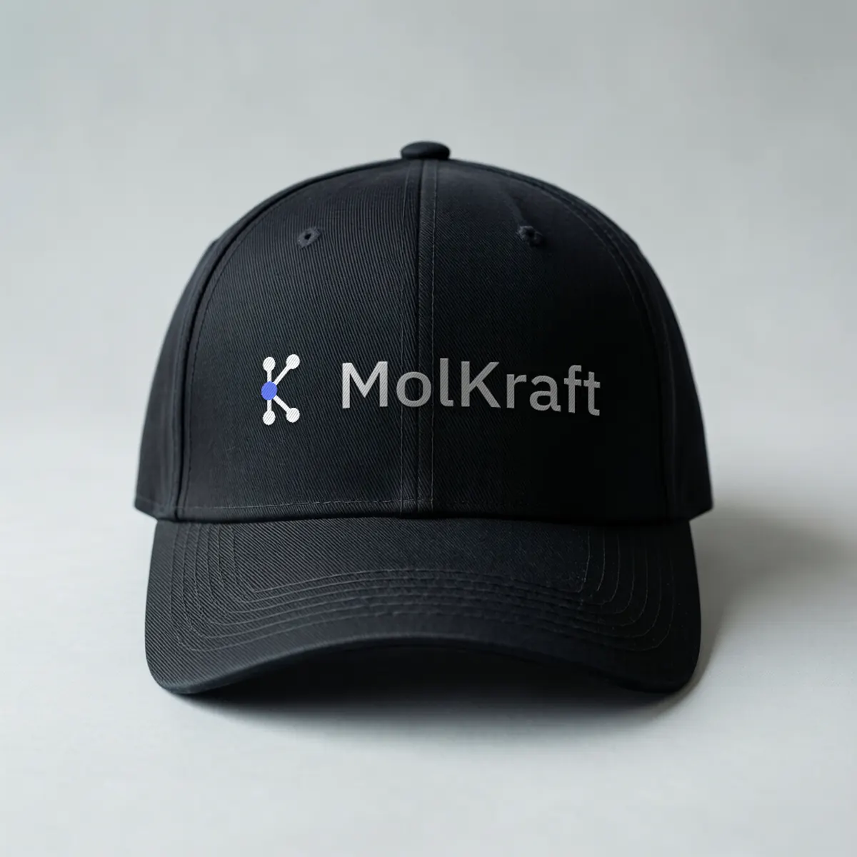 A black cap with the MolKraft logo embroidered across the front.