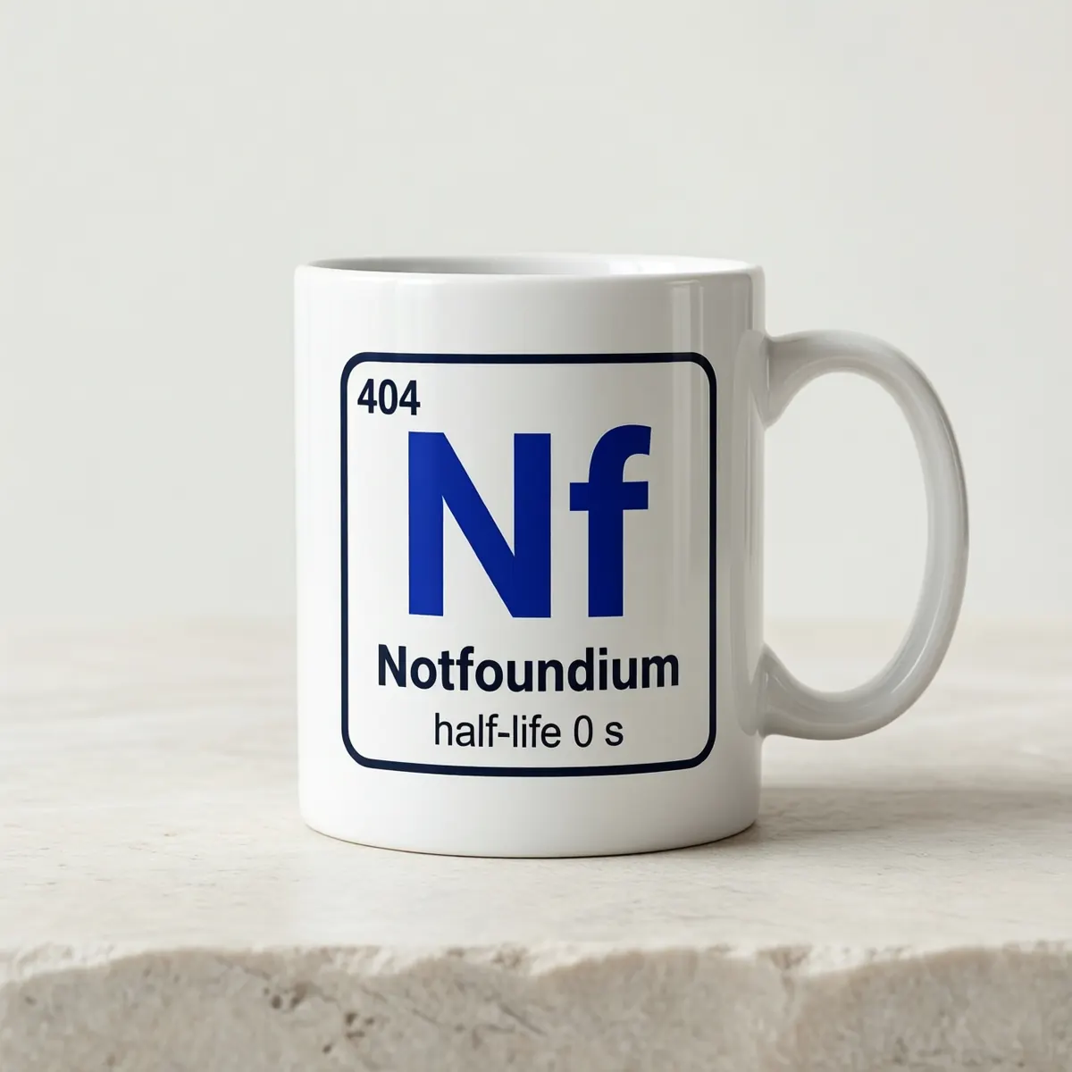 A white ceramic mug printed with the Notfoundium element tile.