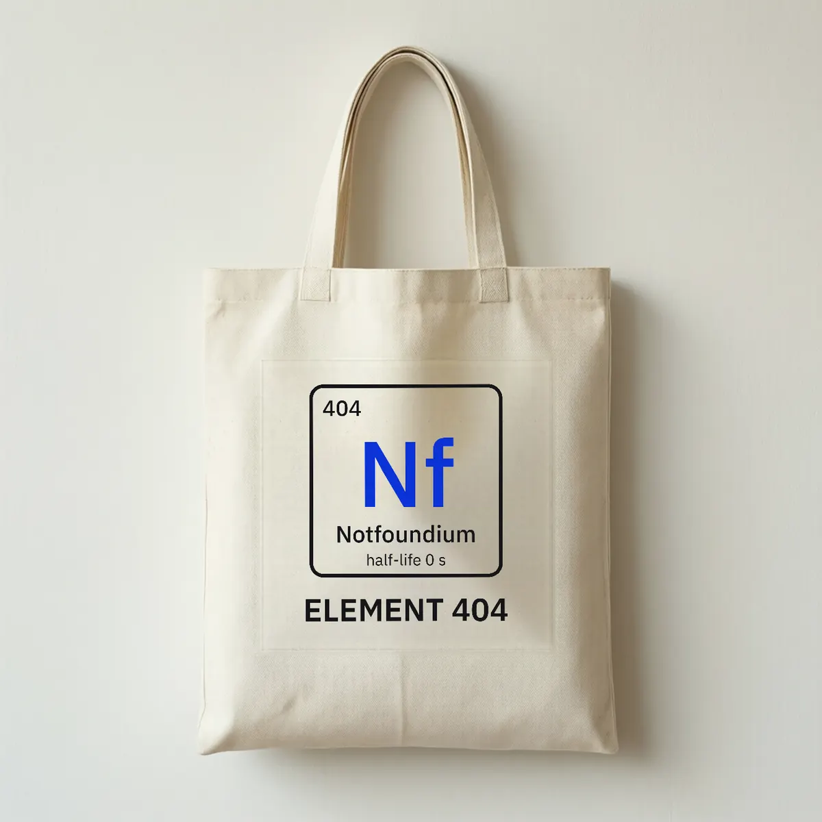 A cream canvas tote bag printed with the Notfoundium element tile and the words ELEMENT 404.